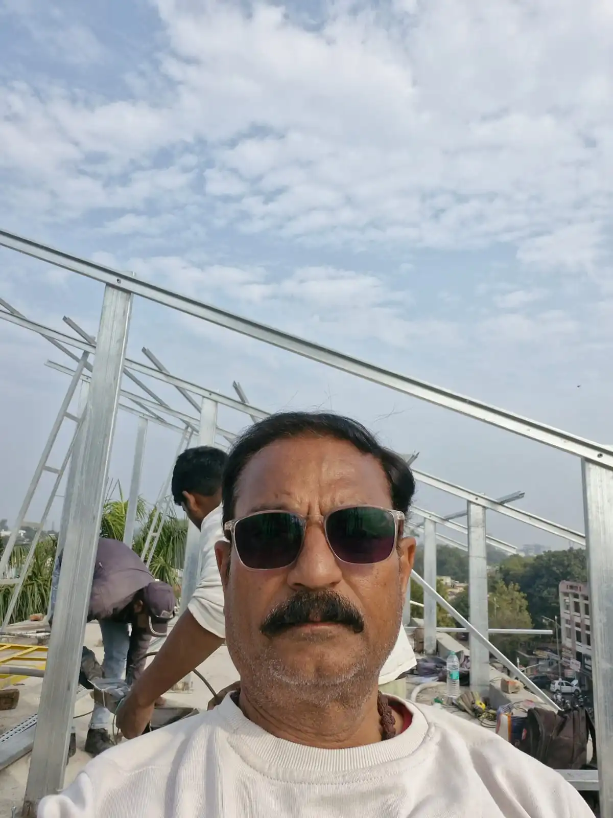 BK Solar owner supervising a rooftop solar structure installation